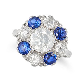 A DIAMOND AND SYNTHETIC SAPPHIRE CLUSTER RING in platinum and 18ct white gold, set with a round b...