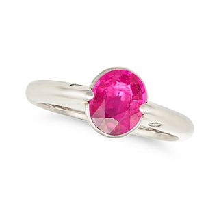 A RUBY AND DIAMOND RING in platinum, set with an oval cut ruby of 1.07 carats, the shoulders acce...