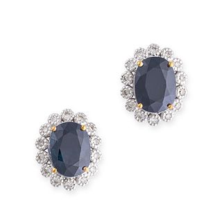 A PAIR OF SAPPHIRE AND DIAMOND CLUSTER EARRINGS in 18ct white and yellow gold, each set with an o...