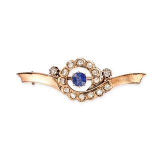 AN ANTIQUE SAPPHIRE AND DIAMOND BROOCH in yellow gold, set with a cushion cut sapphire in a borde...