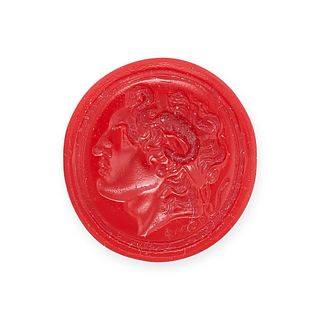 NO RESERVE - A RED GLASS INTAGLIO depicting the bust of Alexander The Great, 2.1cm, 4.2g.