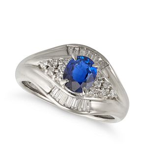 A SAPPHIRE AND DIAMOND RING in platinum, the tapering band set with an oval cut sapphire of 1.10 ...