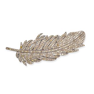 A DIAMOND FEATHER BROOCH in platinum and yellow gold, designed as a feather pave set with single ...
