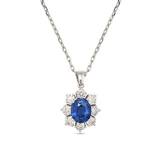 A SAPPHIRE AND DIAMOND PENDANT NECKLACE in 18ct white gold, set with an oval cut sapphire of 1.47...