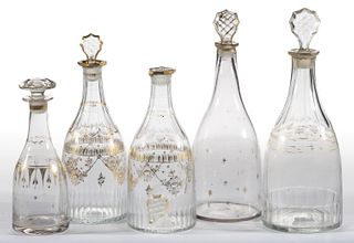 FREE-BLOWN AND ENGRAVED PRUSSIAN-FORM GLASS DECANTERS, LOT OF FIVE