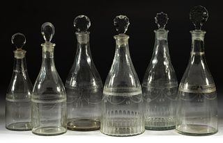 ASSORTED FREE-BLOWN AND ENGRAVED GLASS PRUSSIAN-FORM DECANTERS, LOT OF SIX