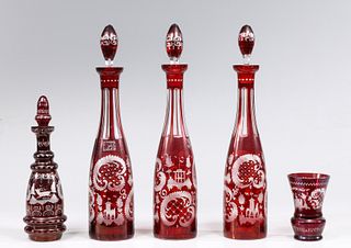 Group of Five Red Czech Glass Decanters and Cup