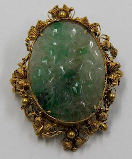 JEWELRY. Carved Jade and 14kt Gold Brooch.