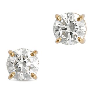 A PAIR OF DIAMOND STUD EARRINGS in 18ct yellow gold, each set with a round brilliant cut diamond,...