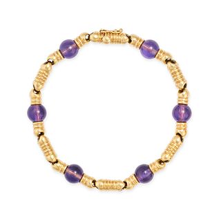 BOUCHERON, A VINTAGE AMETHYST BRACELET in 18ct yellow gold, comprising a row of stylised gold lin...