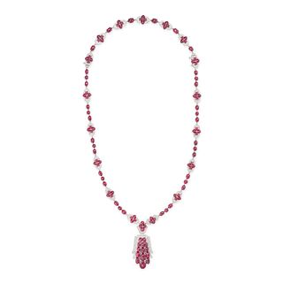 A RUBY AND DIAMOND PENDANT NECKLACE in 18ct white gold, comprising a row of round and oval caboch...