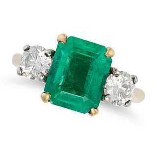 AN EMERALD AND DIAMOND THREE STONE RING in 18ct yellow gold, set with an octagonal step cut emera...