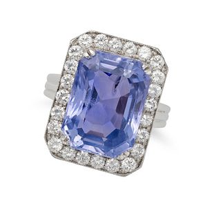 A CEYLON NO HEAT SAPPHIRE AND DIAMOND RING in platinum, set with an octagonal step cut sapphire o...