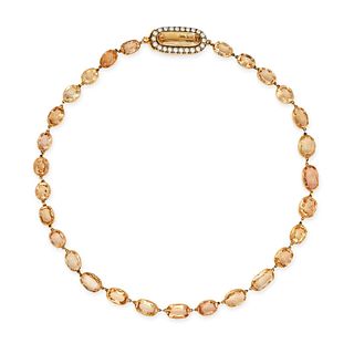 AN ANTIQUE IMPERIAL TOPAZ AND PEARL RIVIERE NECKLACE in 14ct yellow gold, comprising a row of ova...