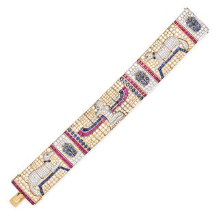 AN EGYPTIAN REVIVAL DIAMOND, SAPPHIRE AND RUBY BRACELET in 18ct yellow and white gold, the articu...