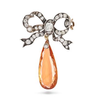 AN ANTIQUE DIAMOND AND IMPERIAL TOPAZ BOW BROOCH in yellow gold and silver, designed as a bow set...