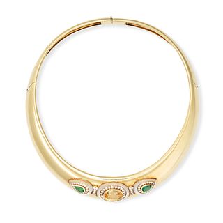 FRED, A YELLOW SAPPHIRE, EMERALD, DIAMOND AND MOTHER OF PEARL TORQUE NECKLACE in yellow gold, the...