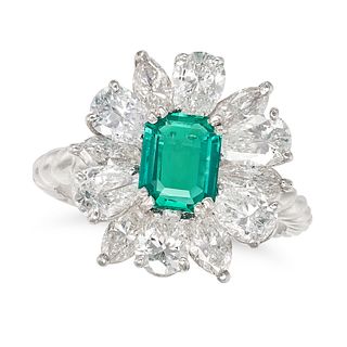 RENE KERN, A FINE EMERALD AND DIAMOND RING in platinum, set with an octagonal step cut emerald of...