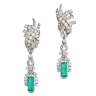 A PAIR OF VINTAGE COLOMBIAN EMERALD AND DIAMOND EARRINGS in white gold, the scrolling tops set wi...