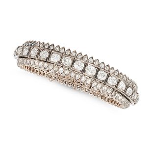 VEVER, AN ANTIQUE DIAMOND BRACELET in 18ct yellow gold and silver, set with a row of graduating o...