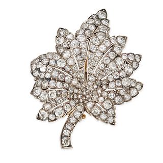 AN ANTIQUE DIAMOND LEAF BROOCH in 18ct yellow gold and silver, designed as a leaf set throughout ...