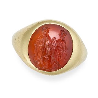 A CARNELIAN INTAGLIO RING, POSSIBLY ANCIENT ROMAN in yellow gold, set with an oval carnelian inta...