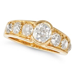 A DIAMOND SEVEN STONE RING in 18ct yellow gold, the tapering band set with seven old cut diamonds...