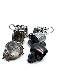 Set Of 4 Figural Napkin rings and a spoon holder silver plated