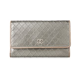 CHANEL QUILTED PEWTER WALLET Condition grade C+. 16cm long, 10cm high. Produced between 2006 an...