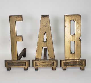 Mid-Century Modern Brass "FAB" Figural Alphabetical Andirons
