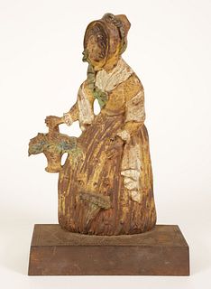 Bradley and Hubbard Painted Cast Iron Doorstop of a Lady Holding a Flower Basket