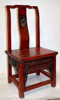 Chinese red lacquer child's chair with drawer under seat.