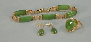 Four piece lot with jade and 18K ring, jade and 14K bracelet and earrings.