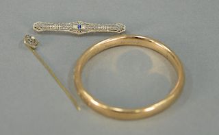 Three piece lot to include 18K bangle bracelet, 14K bar pin with blue sapphire and two diamonds, and a 14K stickpin. total we
