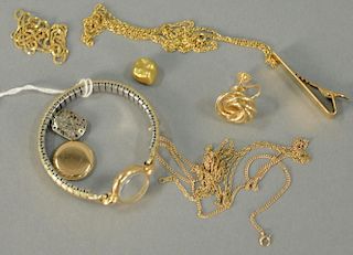 Group of 14K and 18K gold chains, tie clip, one earring, one tooth cup, and ladies gold wristwatch (as is). 22.3 grams