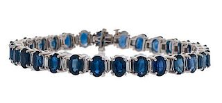 Blue Sapphire and Baguette Diamond Bracelet in 18 Karat White Gold 