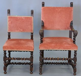 Set of eight oak dining chairs with carved lions on turned legs.