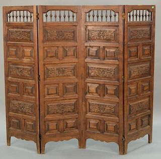 Carved wood four fold dressing screen. ht. 59in., wd. 68in.