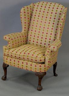 Chippendale style upholstered wing chair.