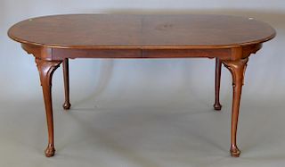 Henkel Harris mahogany oval dining table with banded inlaid top and two leaves, top: 47" x 70", opens to 102".