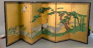Japanese Kano school six panel folding screen, 19th century screen depicting cranes, pines, and bamboo on a river bank. ht. 2