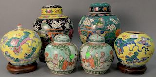 Six piece lot to include three pairs of Oriental Porcelain jars with carved hardwood stands (one cover missing). ht. 8in. to 