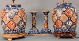 Four piece lot with pair of Imari style lamps (total ht. 26in.) and candlesticks (ht. 11in.).