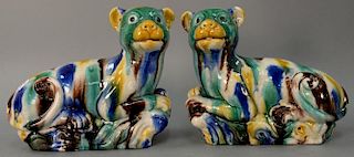 Pair of glazed recumbent dog figures. ht. 10in., lg. 12in.