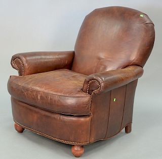 Brown leather easy chair.