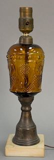 Amber glass oil lamp with base. ht. 15in.