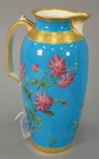 Mintons porcelain handled urn, having blue ground with enameled flowers and gilt decoration. ht. 9 1/2in.