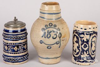 Two German stoneware tankards and a jug, 19th c.