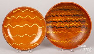 Two slip decorated redware plates