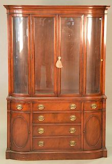Two piece lot to include a mahogany breakfront with bowed glass, ht. 72in., wd. 47in. and a crystal chandelier.